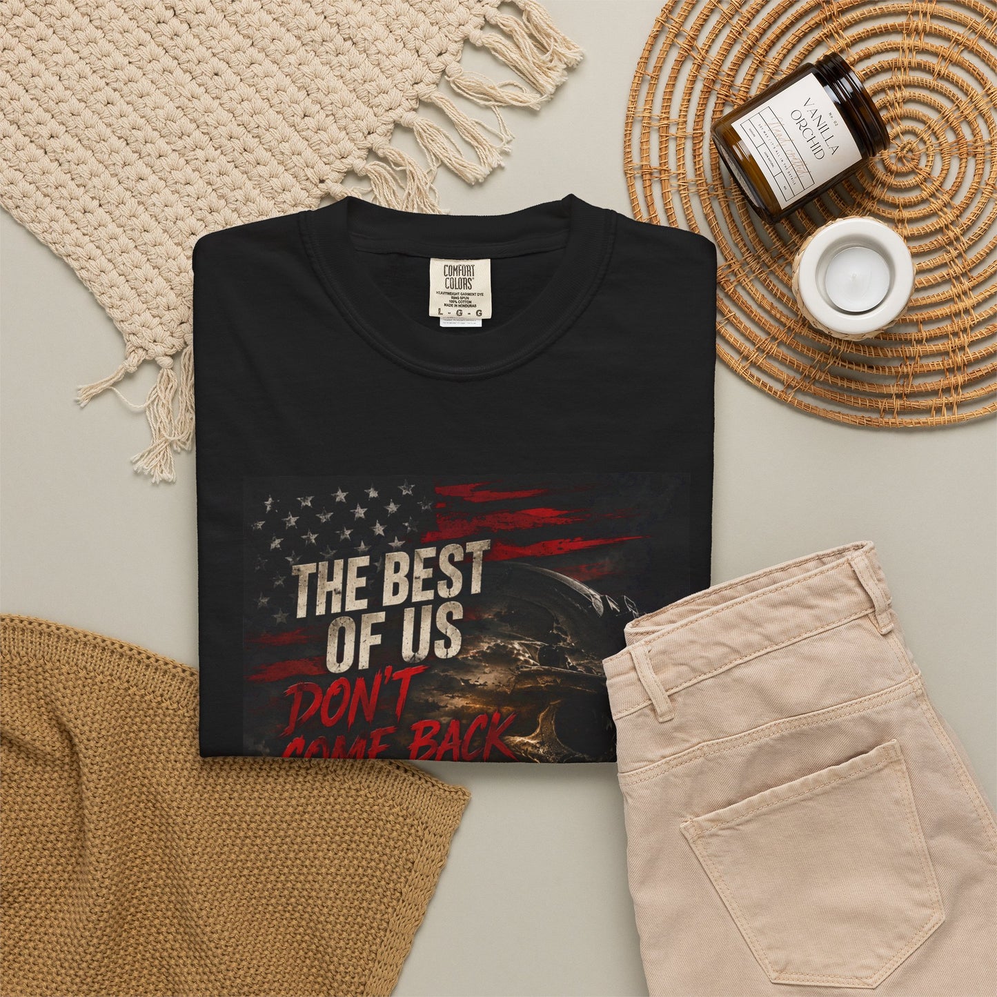 Vintage Garment-Dyed Tee #15 in black, featuring a graphic design with text, styled with beige pants and accessories.