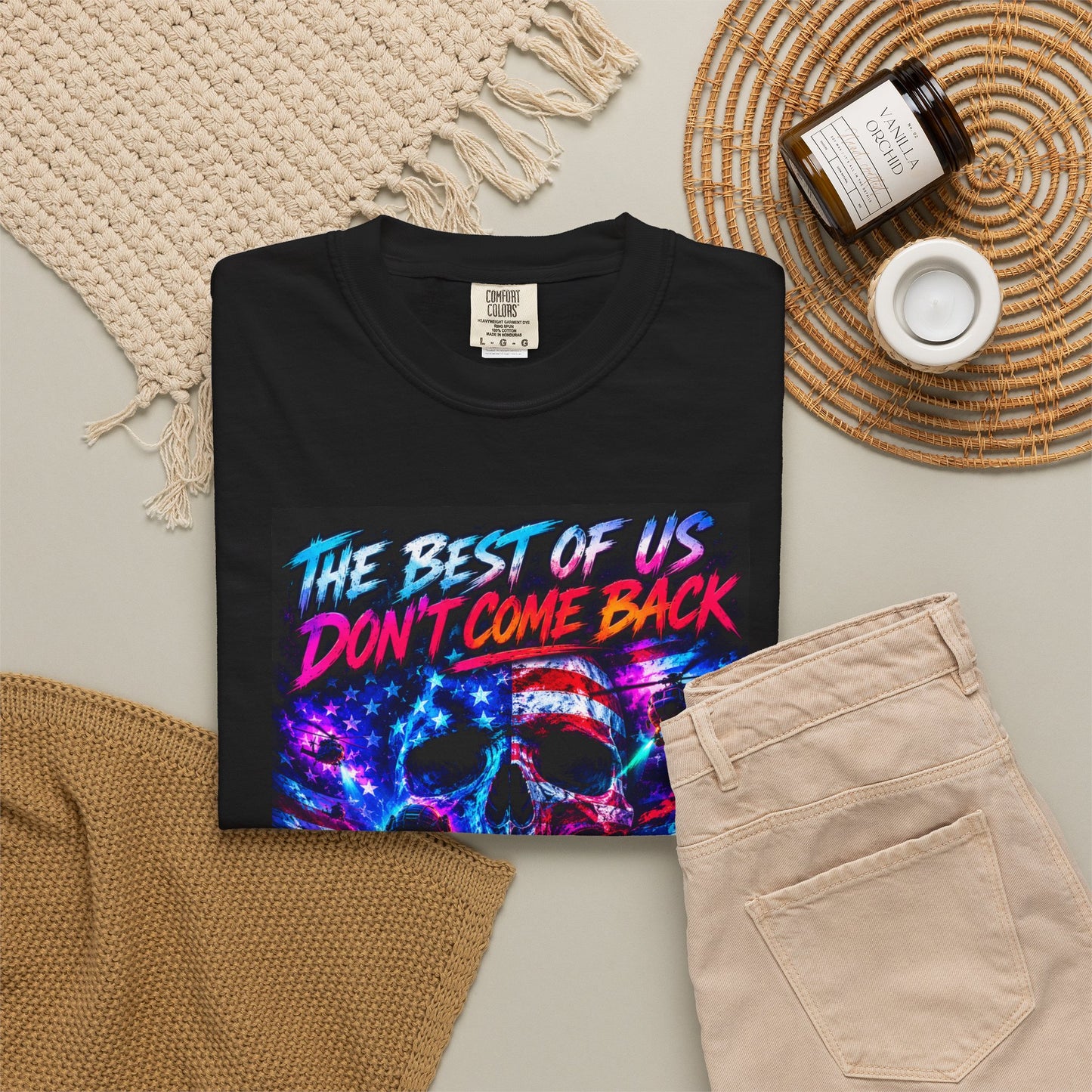 Vintage Garment-Dyed T-Shirt #18 in black with colorful skull and text design, styled with beige pants and accessories.