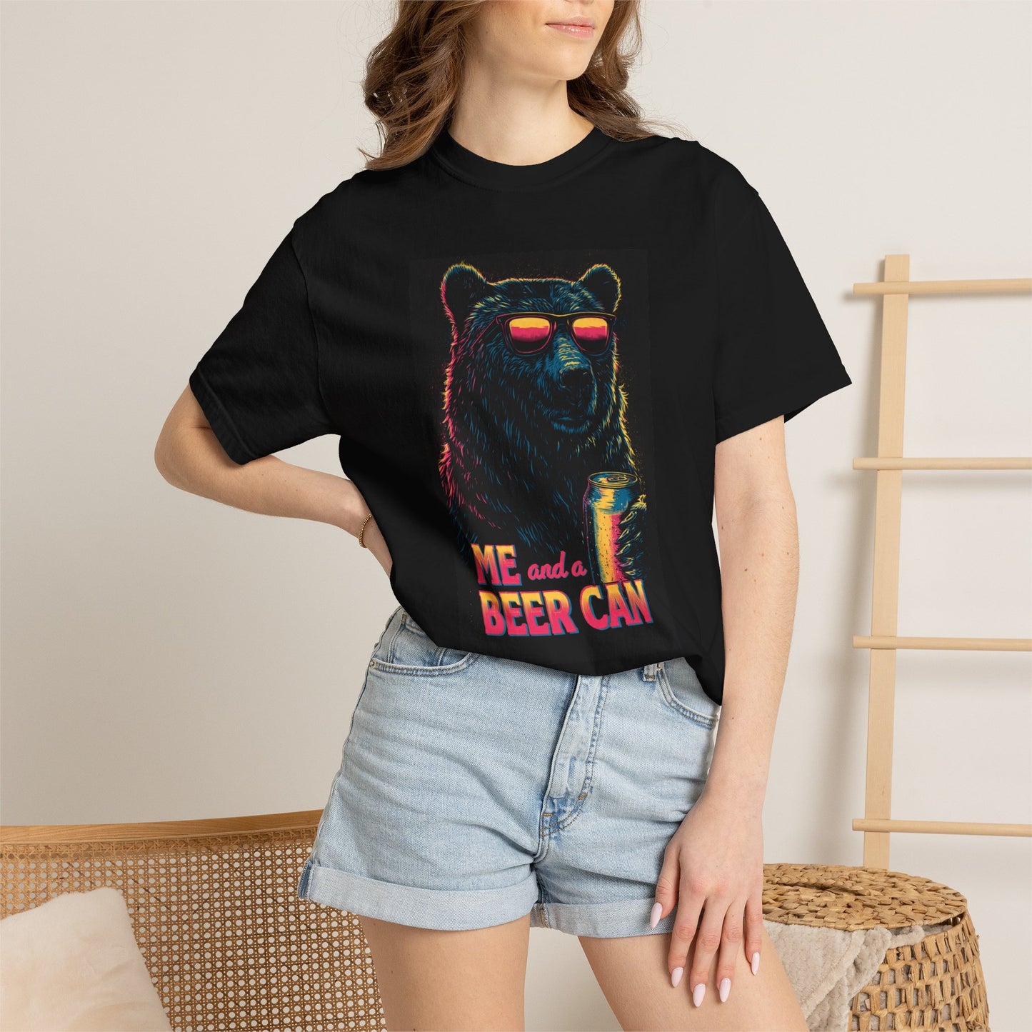 Unisex Beer Can T-shirt featuring a colorful bear graphic wearing sunglasses, paired with denim shorts.