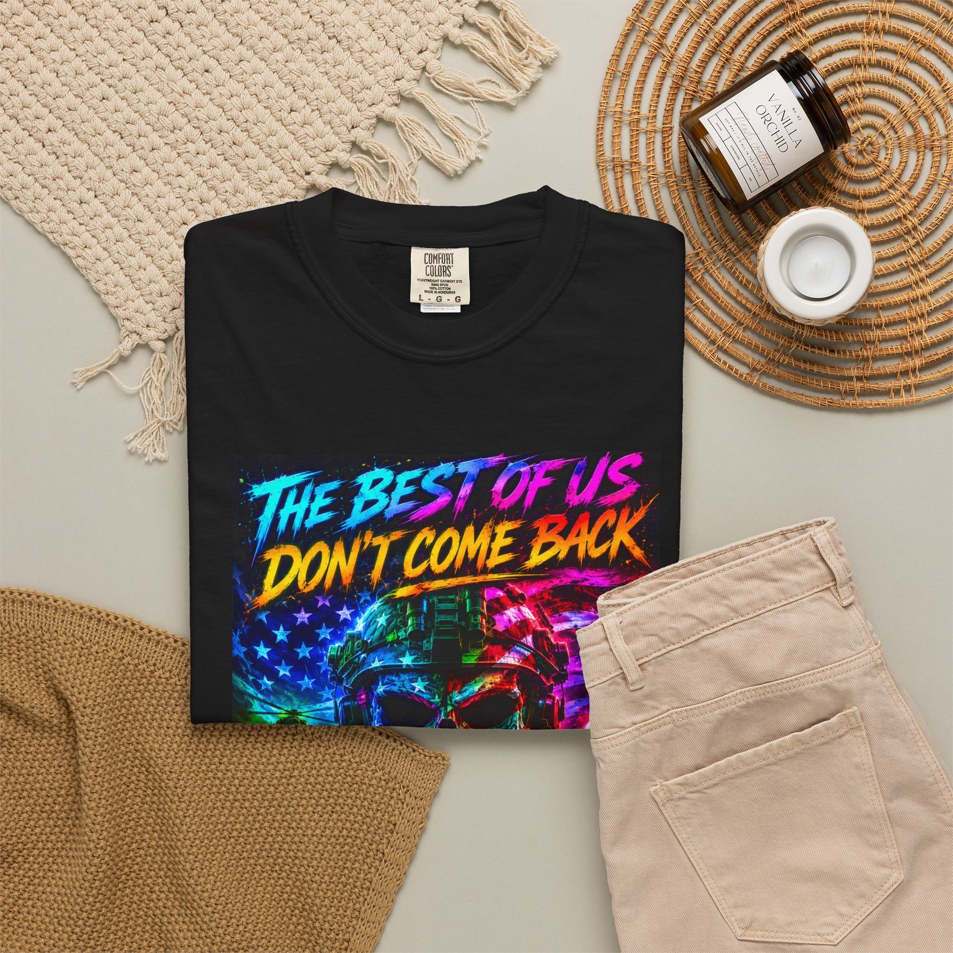 Vintage Garment-Dyed T-Shirt #16 in black with colorful graphic text "THE BEST OF US DON'T COME BACK" on a flat lay with beig