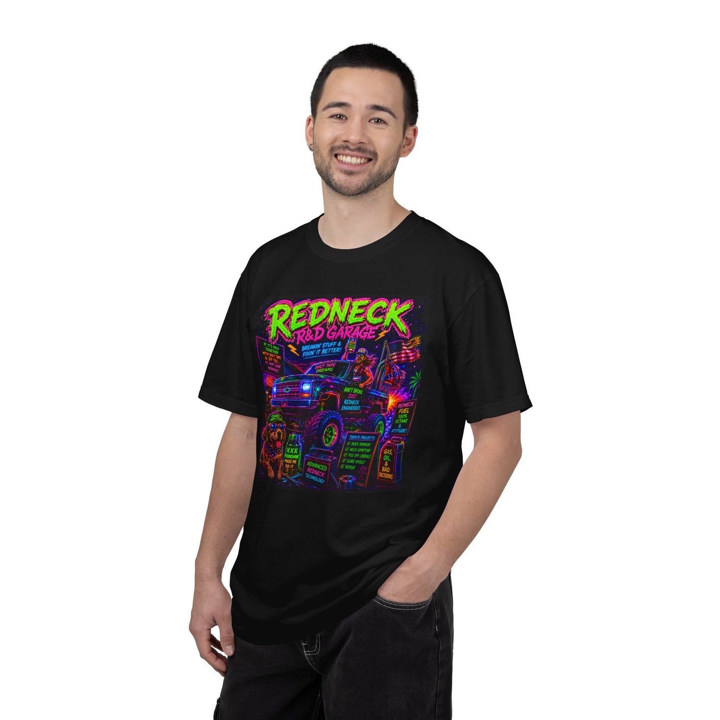 Vintage Garment-Dyed T-Shirt #13 featuring a colorful "Redneck Red Garage" graphic on a black background, worn by a smiling m