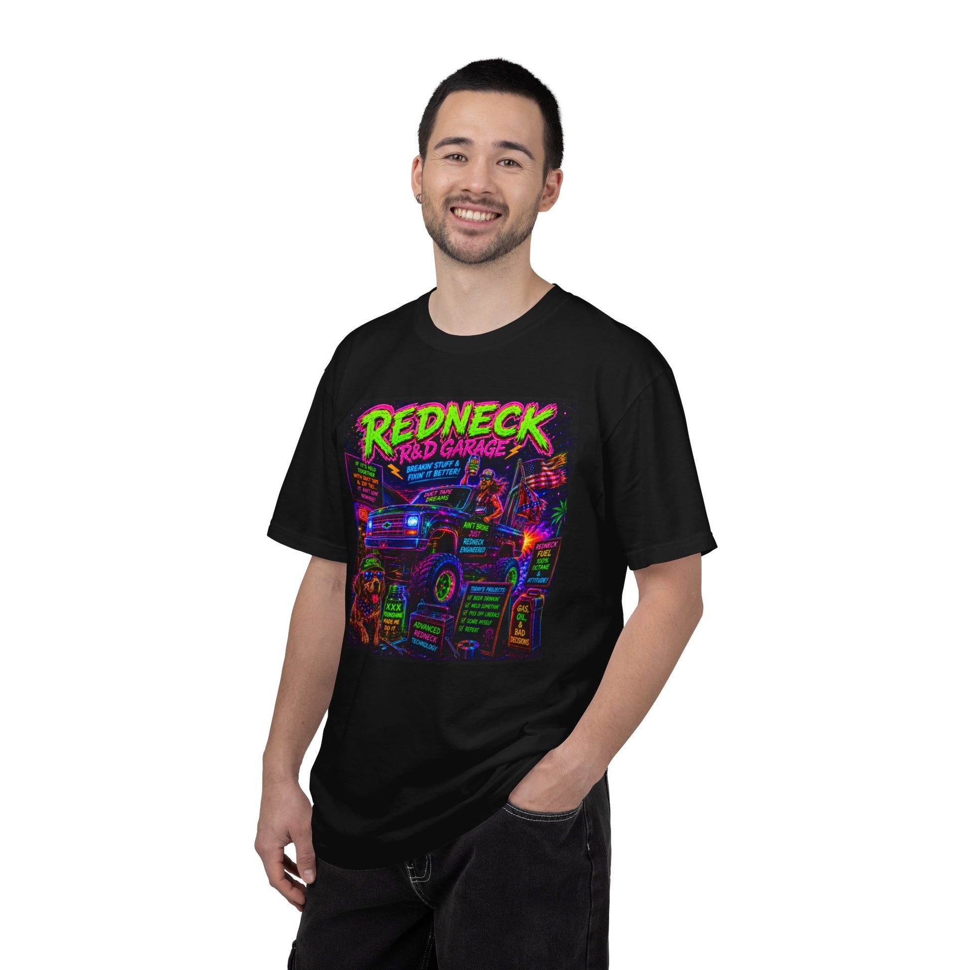 Vintage Garment-Dyed T-Shirt #13 featuring a colorful "Redneck Red Garage" graphic on a black background, worn by a smiling m
