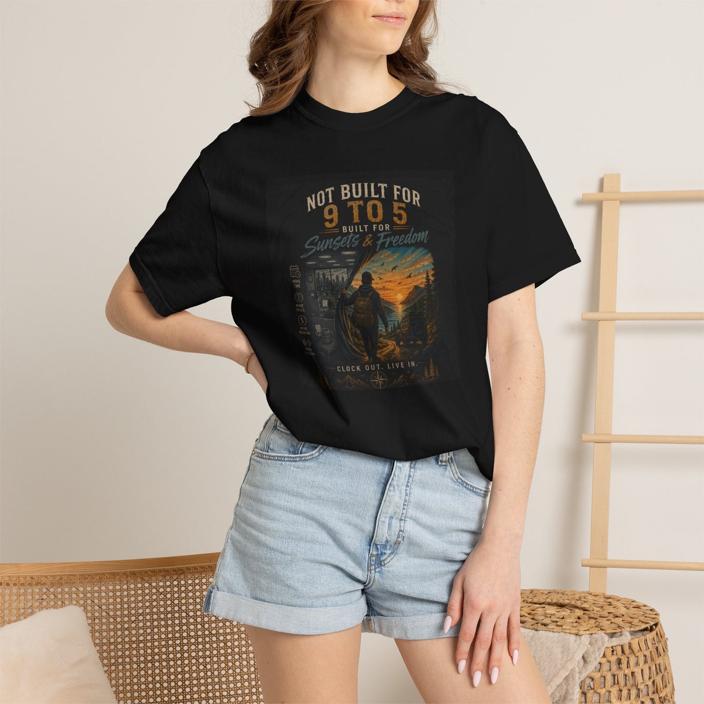 Black "Not Built for 9 to 5" t-shirt featuring a colorful graphic design, paired with denim shorts. Casual style for rebels a