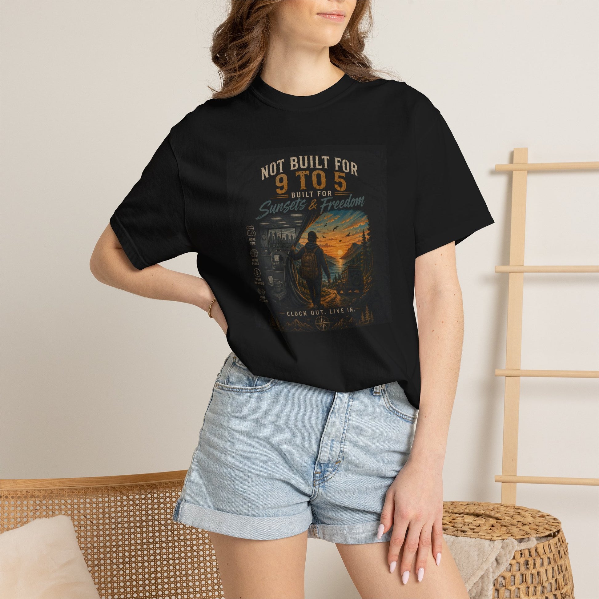 Black "Not Built for 9 to 5" t-shirt featuring a colorful graphic design, paired with denim shorts. Casual style for rebels a