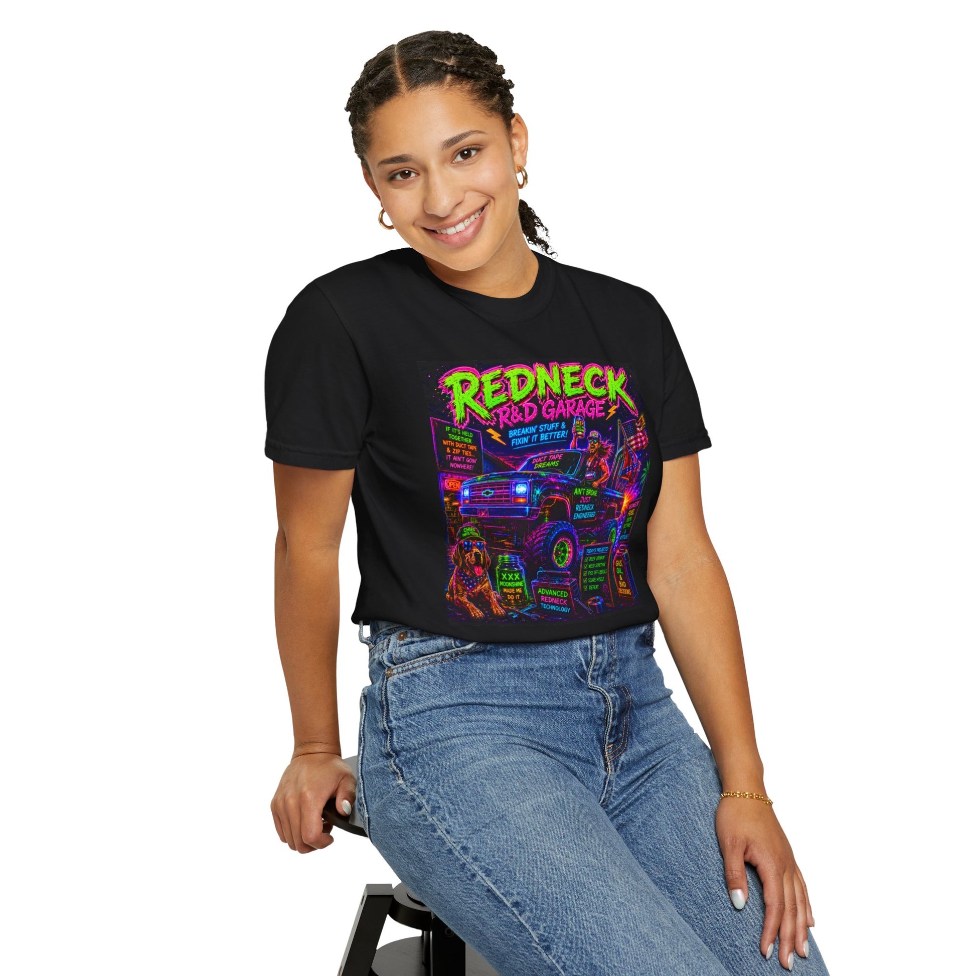 Vintage Garment-Dyed T-Shirt #13 in black featuring colorful "Redneck Garage" graphic, worn by a smiling model.