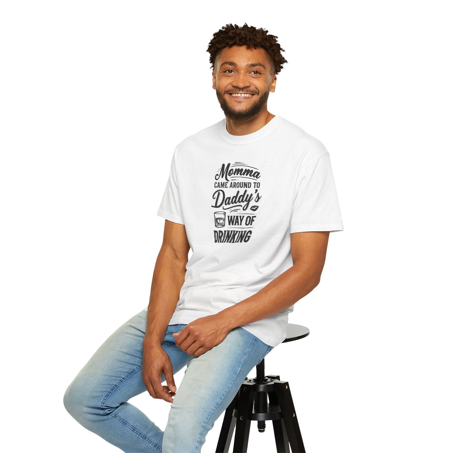 Unisex Way of Drinking T-shirt in white, featuring a playful graphic text design. Model sitting on a stool, smiling.