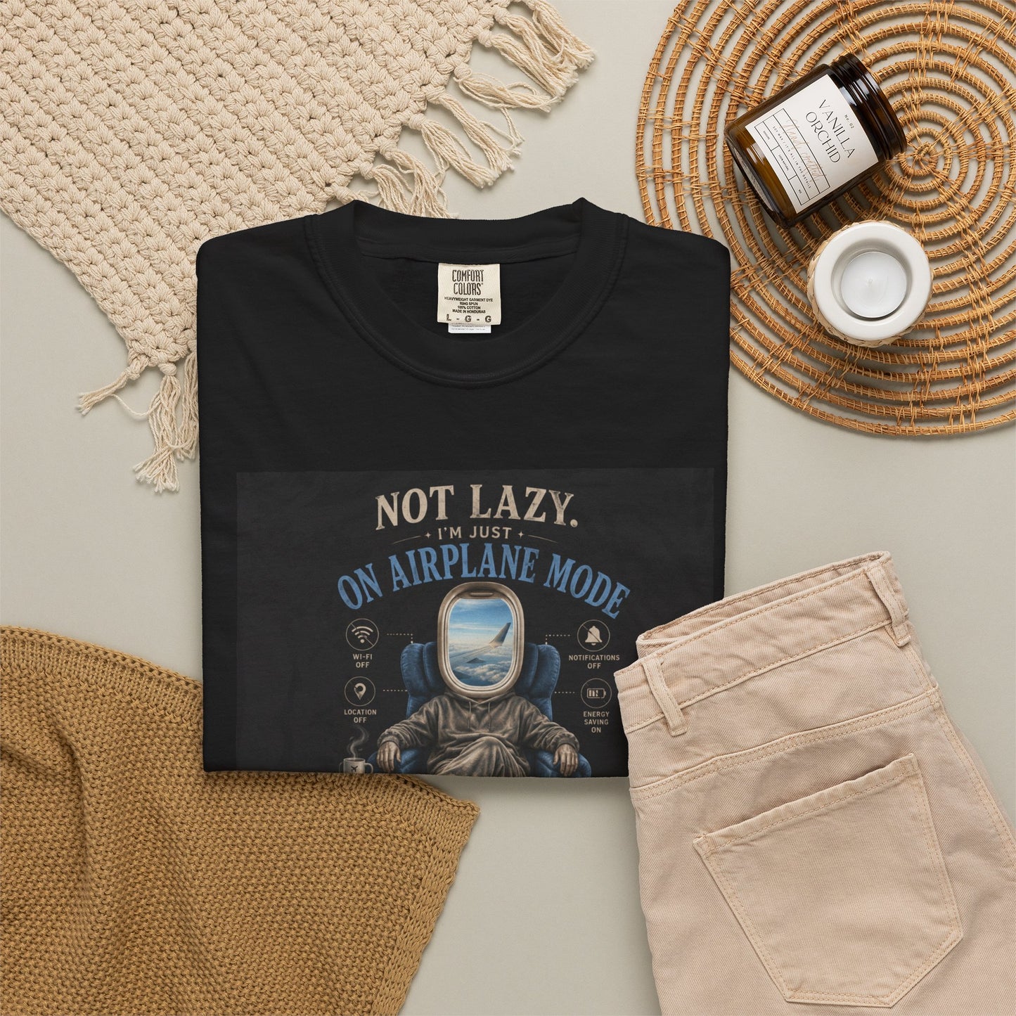 Black t-shirt featuring the phrase "Not Lazy, Just on Airplane Mode" with a graphic of a person relaxing in a chair.