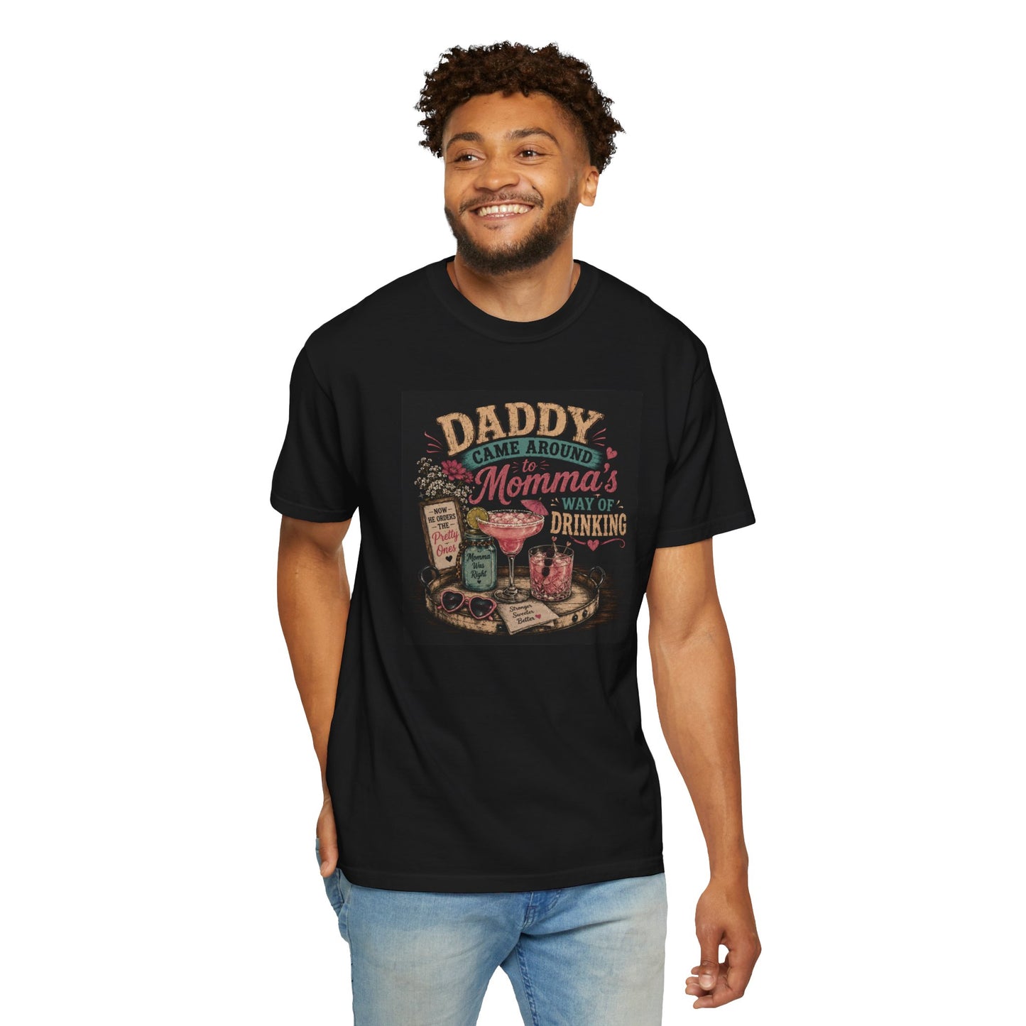 Black t-shirt featuring a humorous graphic that reads "Daddy Came Around Momma's Way of Drinking," styled with colorful drink