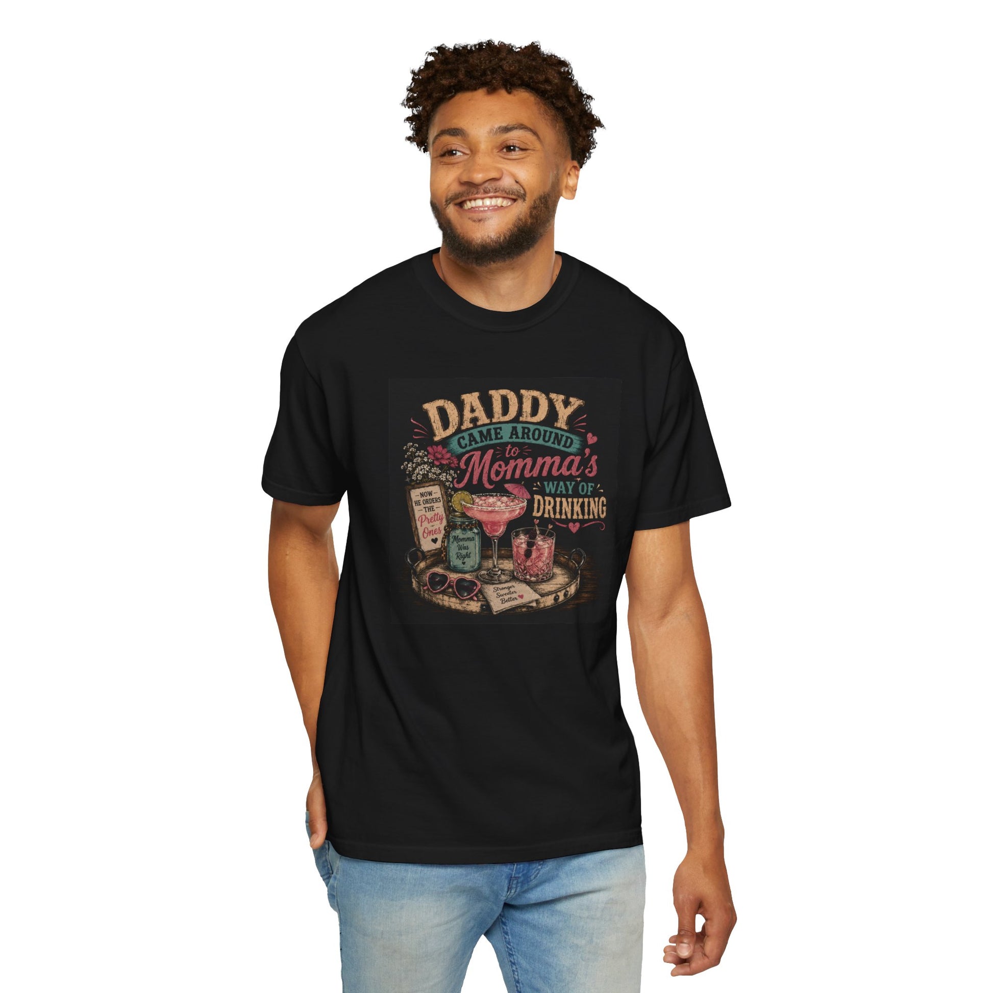 Black t-shirt featuring a humorous graphic that reads "Daddy Came Around Momma's Way of Drinking," styled with colorful drink