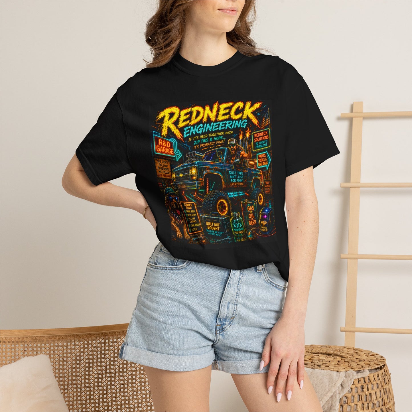 Vintage Garment-Dyed T-Shirt #14 featuring a colorful "Redneck Engineering" graphic on a black background, worn by a model.