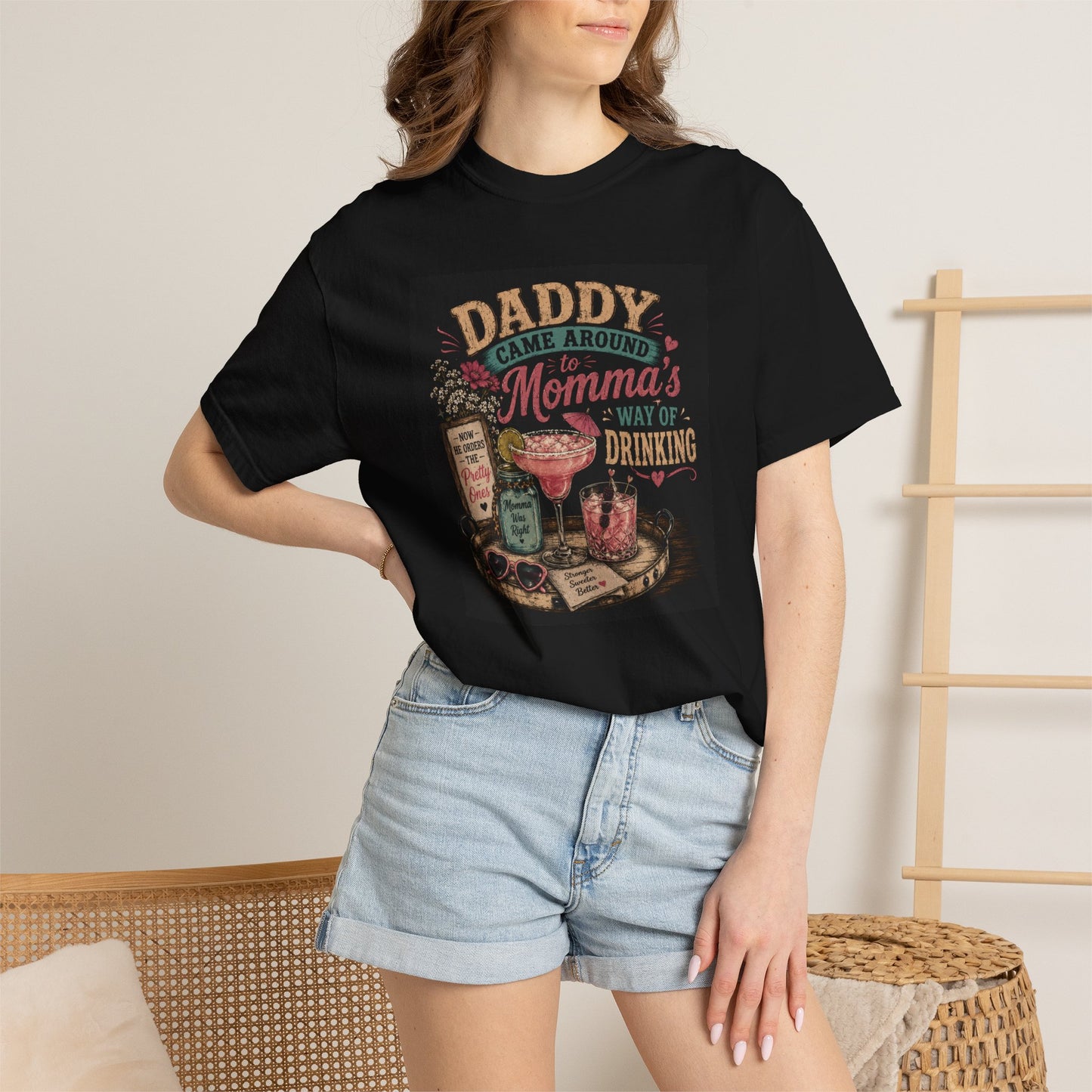 Black t-shirt featuring a humorous graphic that reads "Daddy Came Around to Momma's Way of Drinking," styled with drinks and 