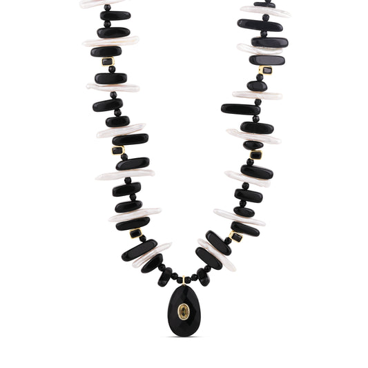 Onyx & Baroque Pearl Statement Necklace featuring alternating black onyx and white baroque pearl beads with gold accents.
