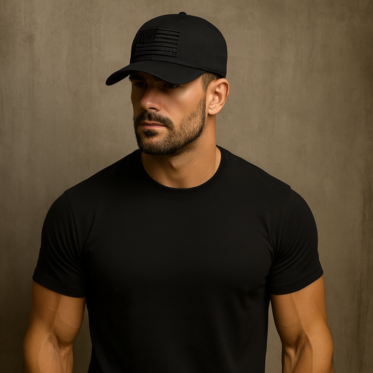 FLEX-FIT American Flag Blackout Hat on a model wearing a black t-shirt, showcasing a sleek and stylish design.