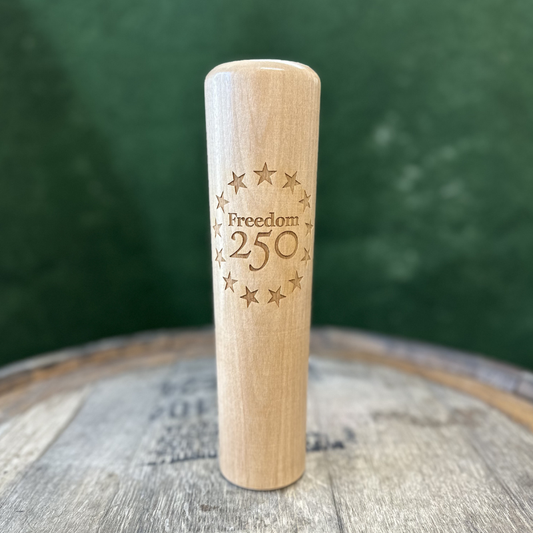 The Freedom250™ Dugout Mug® is a wooden mug shaped like a baseball bat, featuring engraved "Freedom 250" and stars.